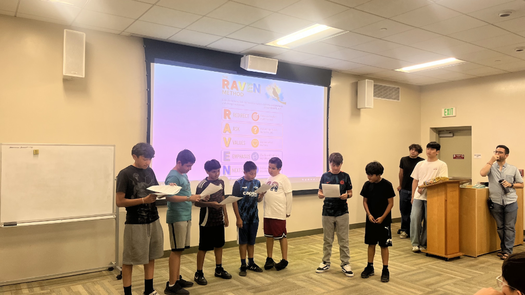 Students presenting the RAVEN method during a Macro Movement classroom workshop